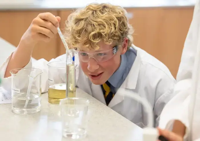 Boy doing science experiment