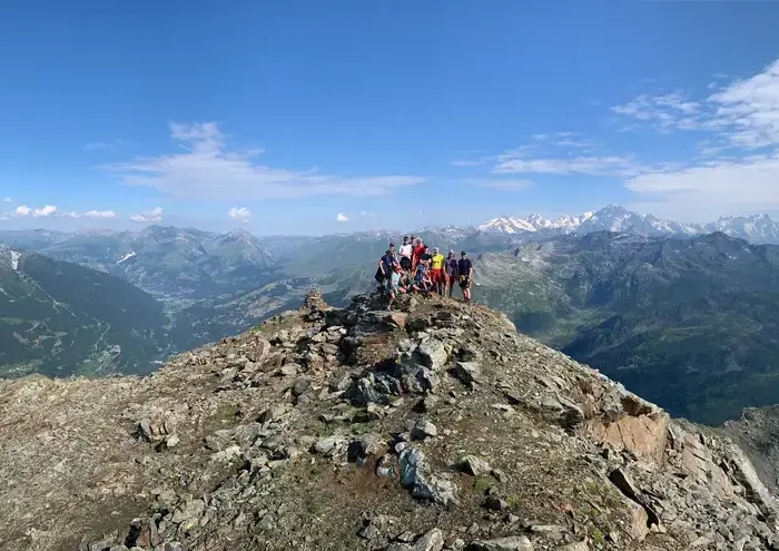 Group of students at the top of a mountain