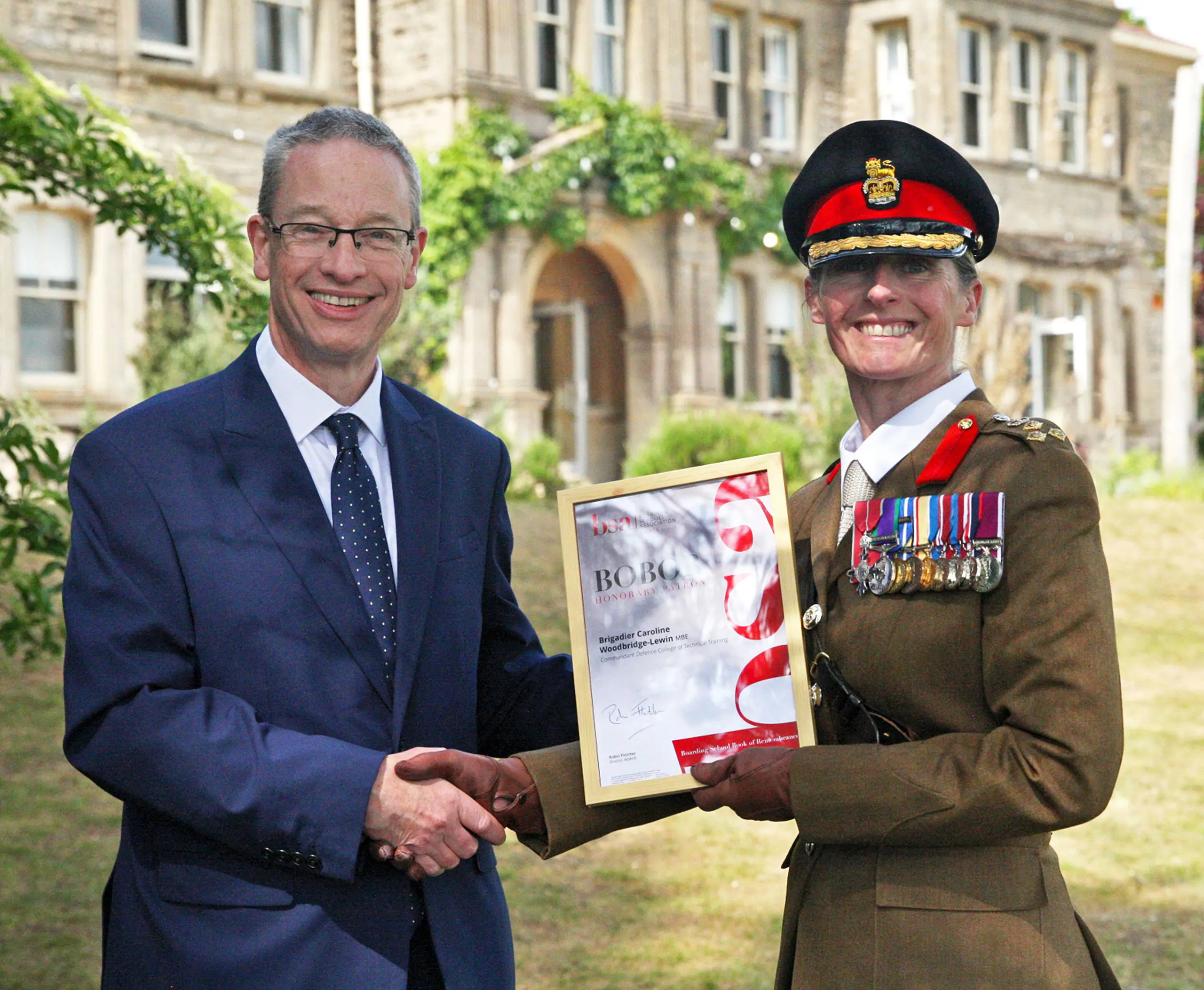 decorated officer receiving a degree