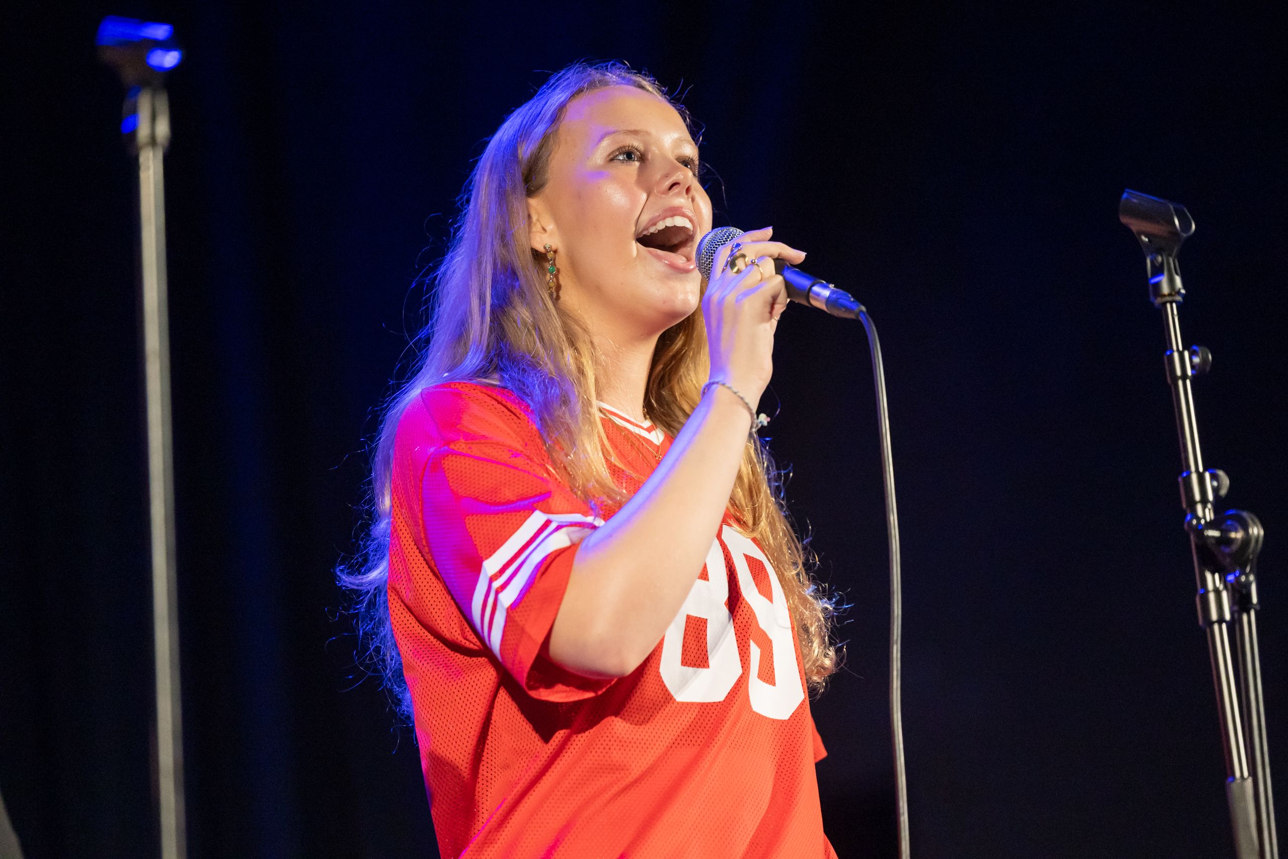 girl singing on stage
