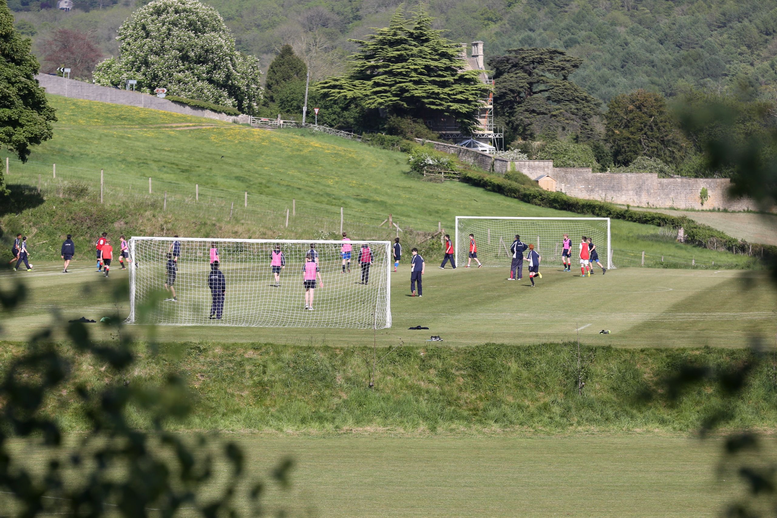 boys and girls playing on pitches