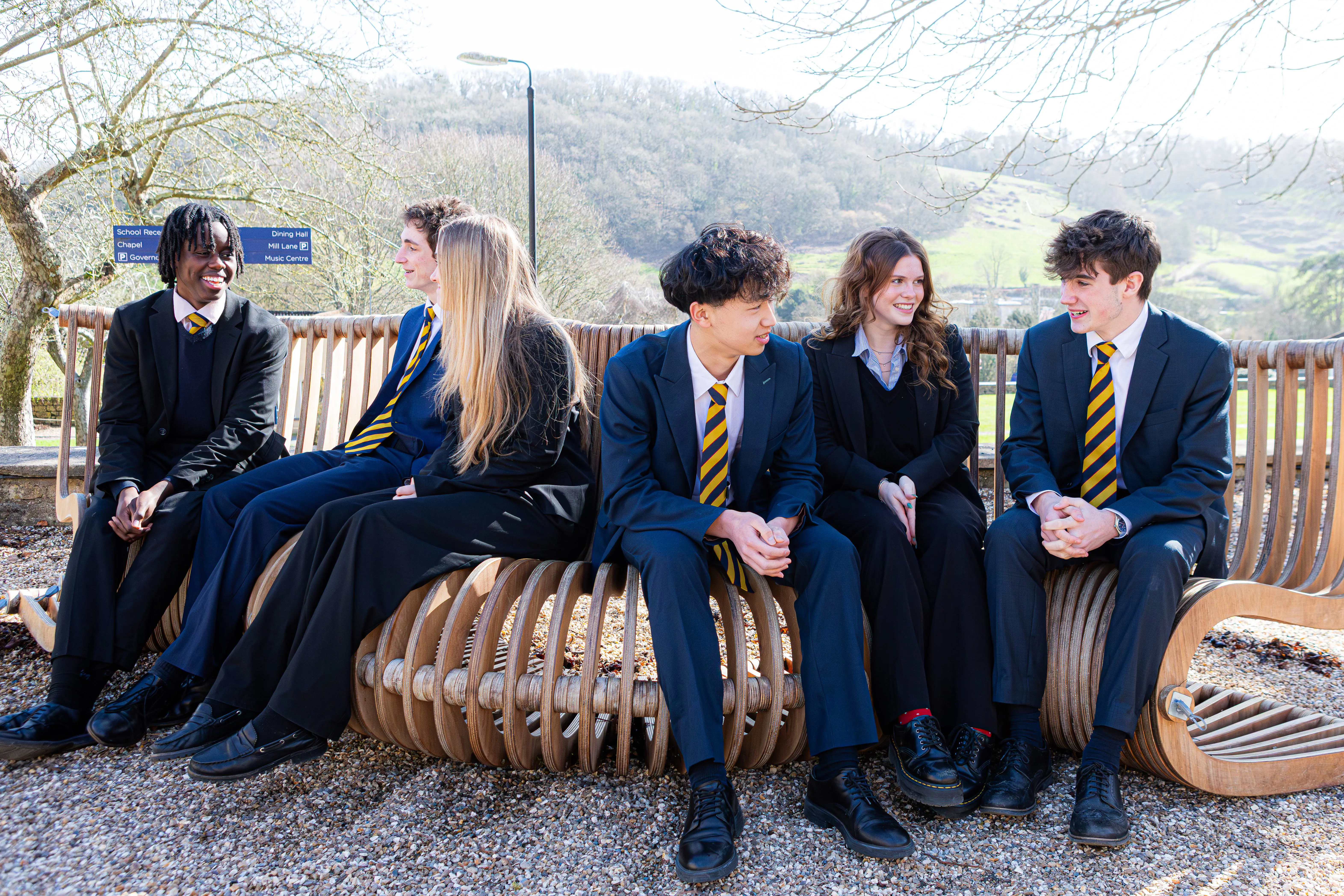 Co-ed students talking outside