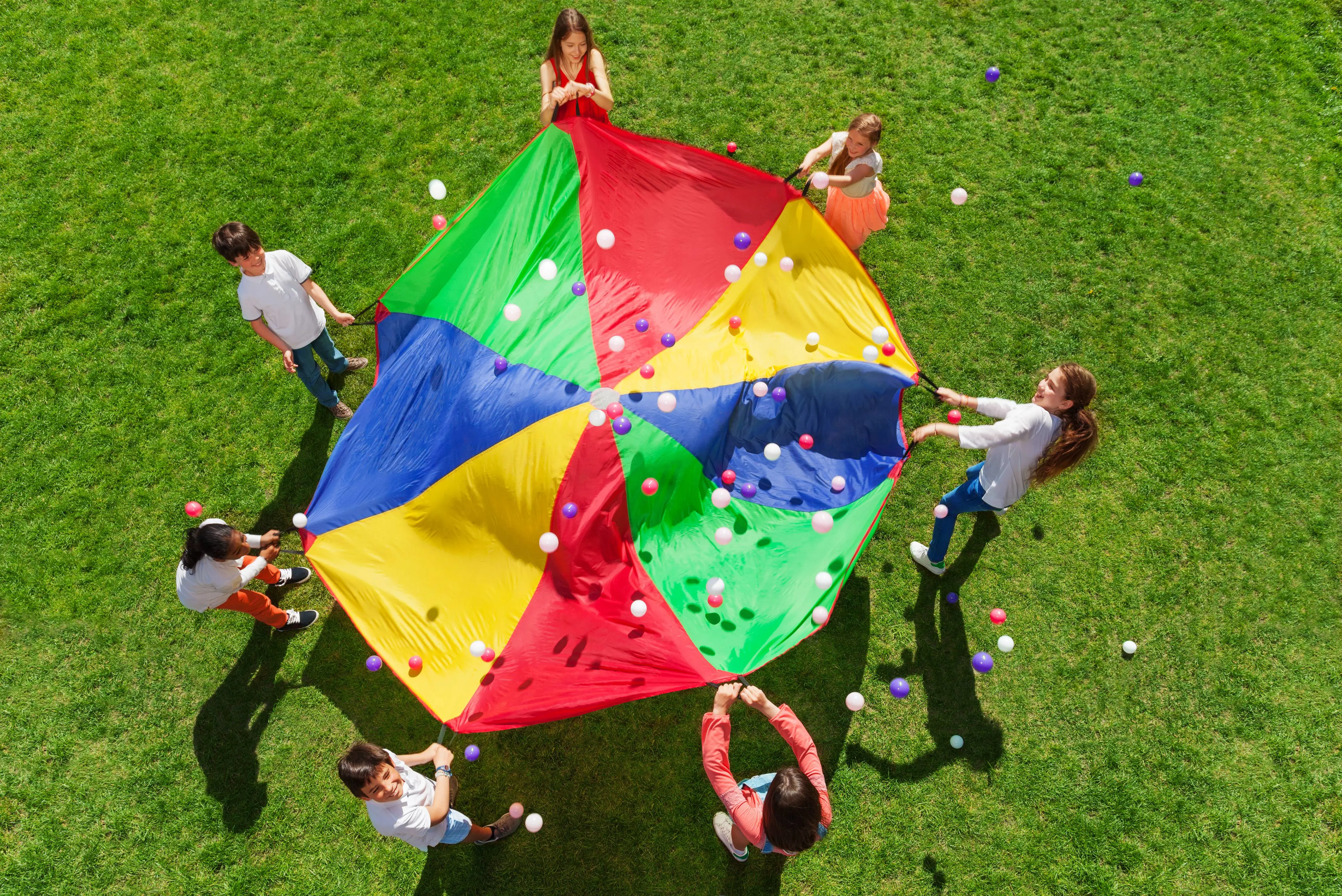Children playing parachute game