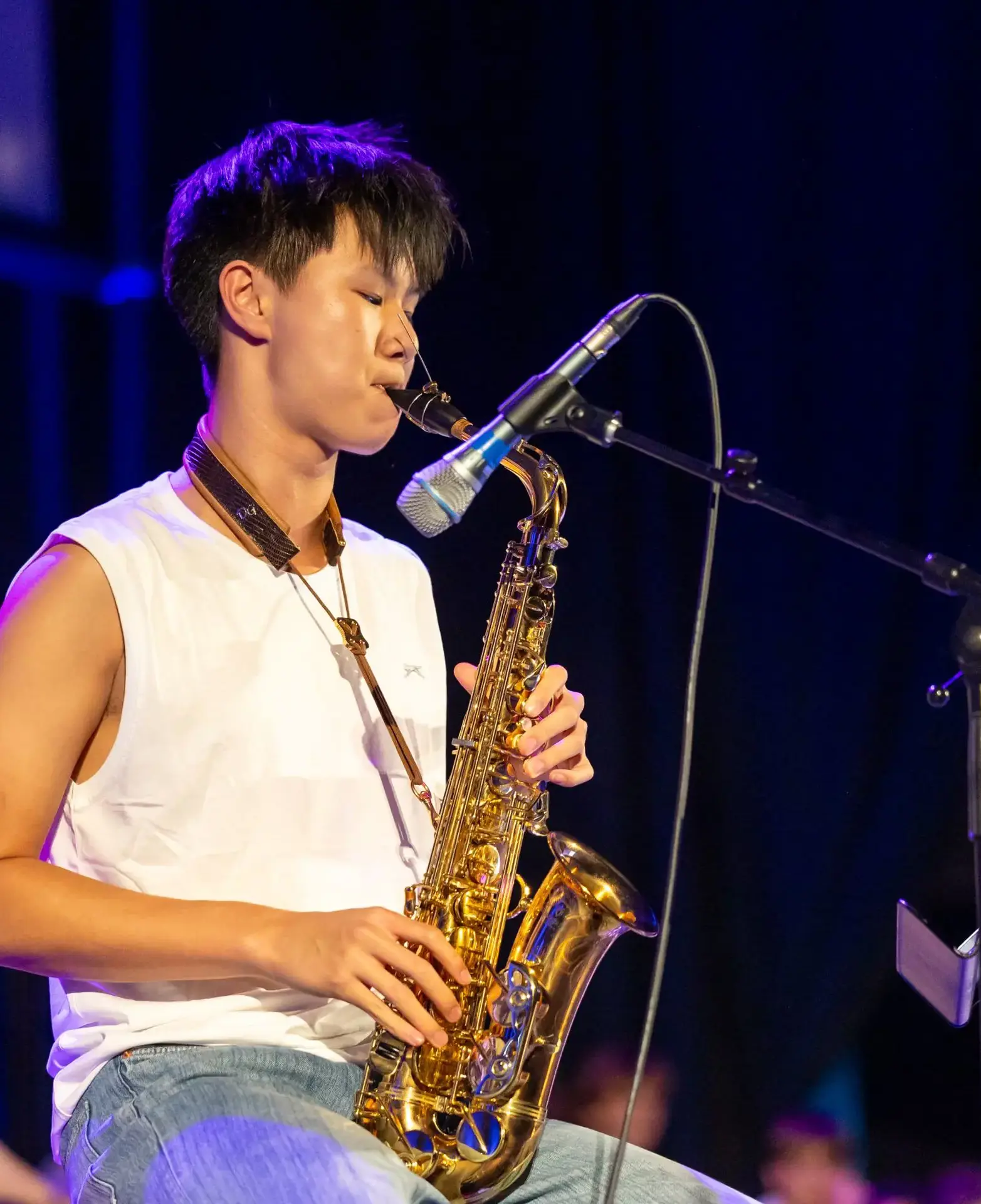 boy playing saxophone