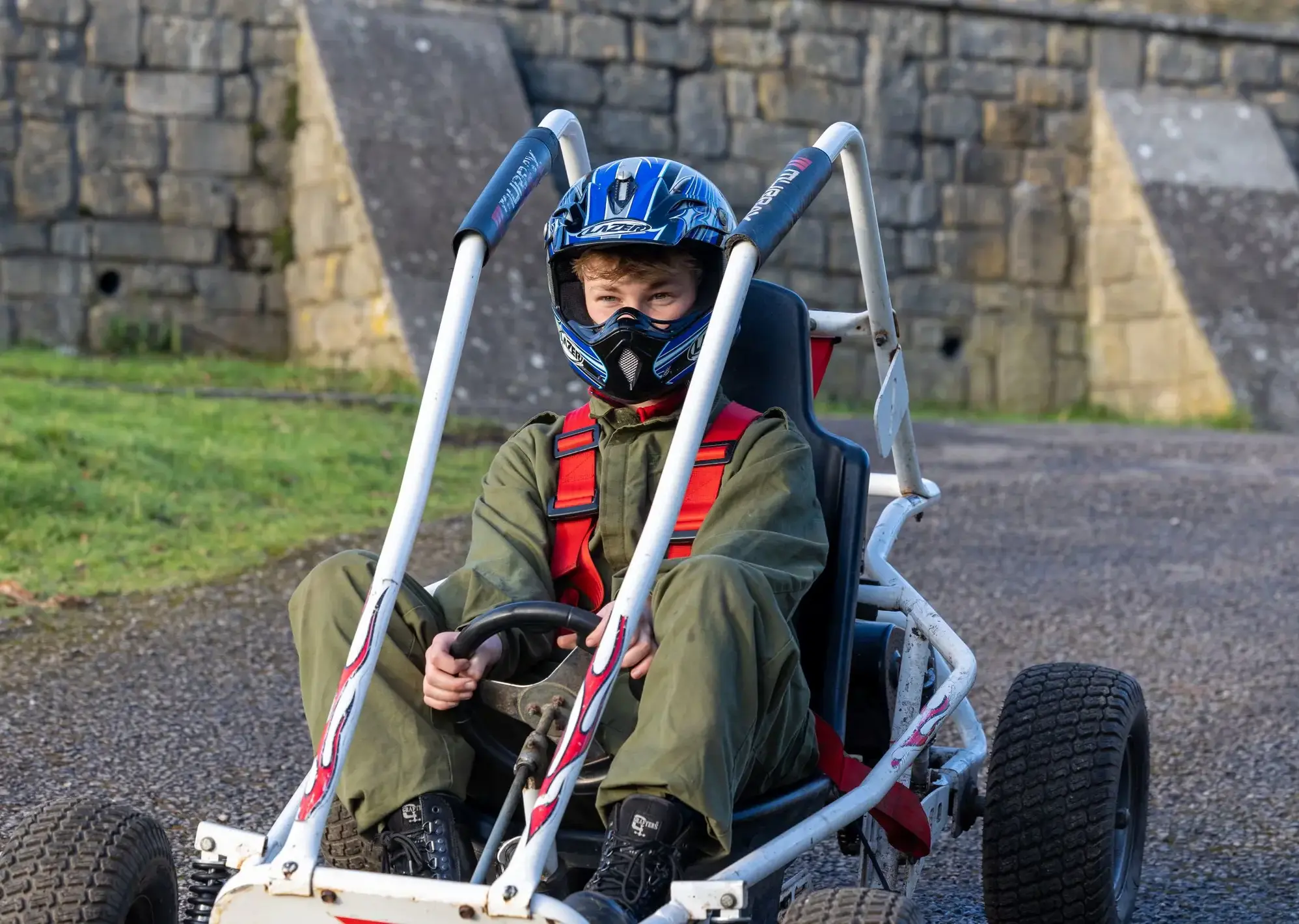 boy driving go kart