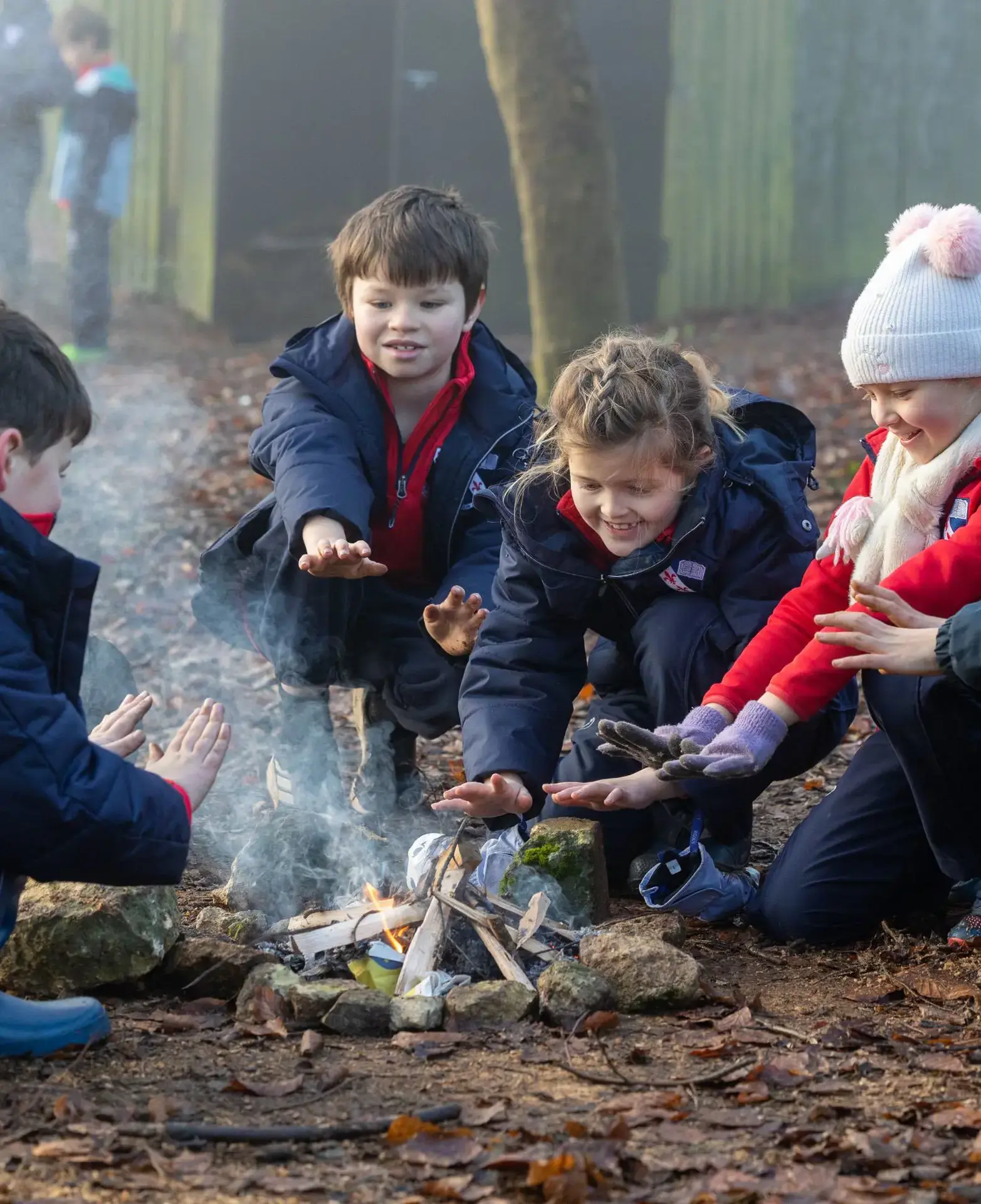 Group of children around a campfire