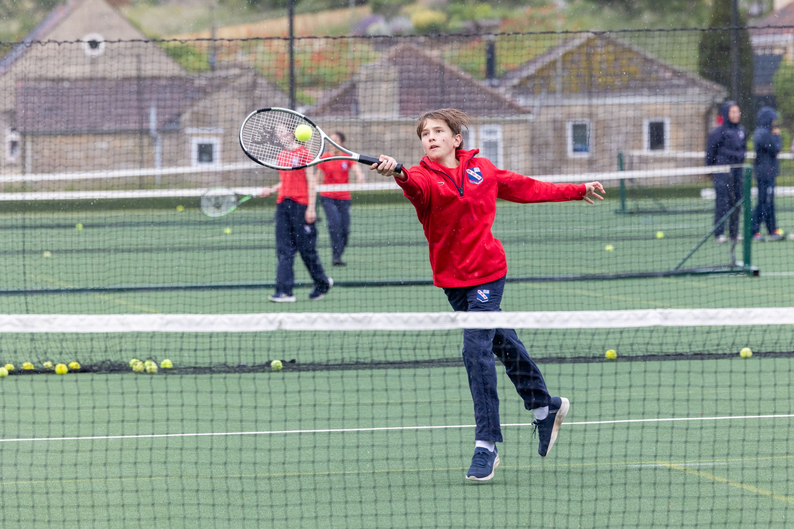 boy playing tennis