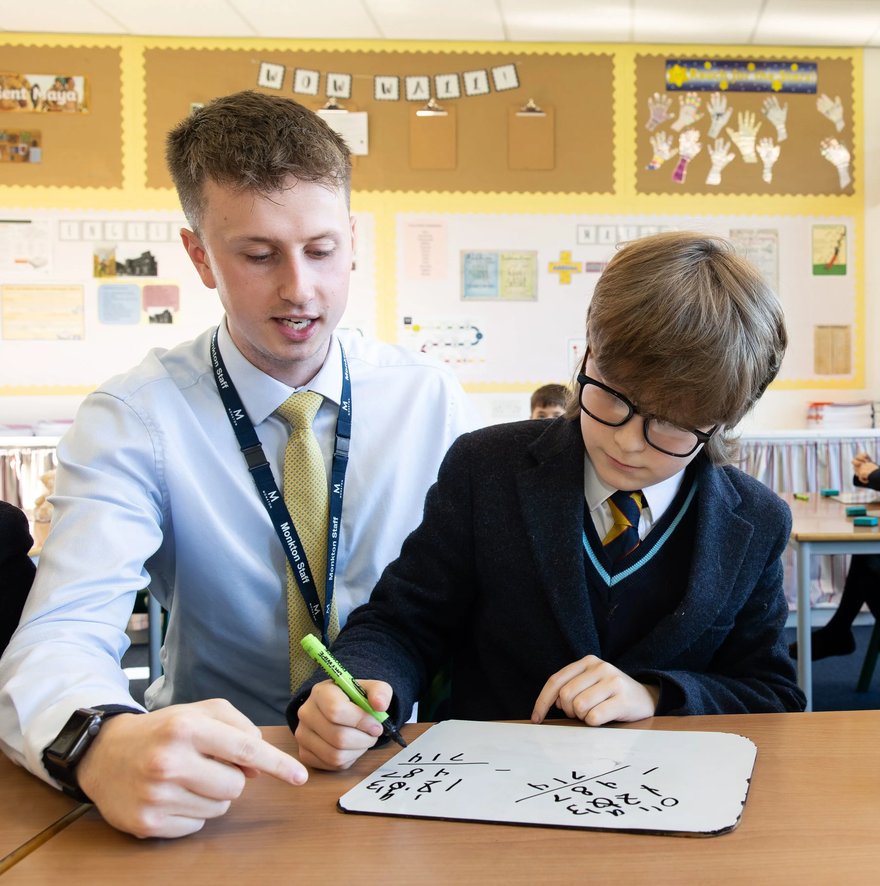 teacher helping  boy