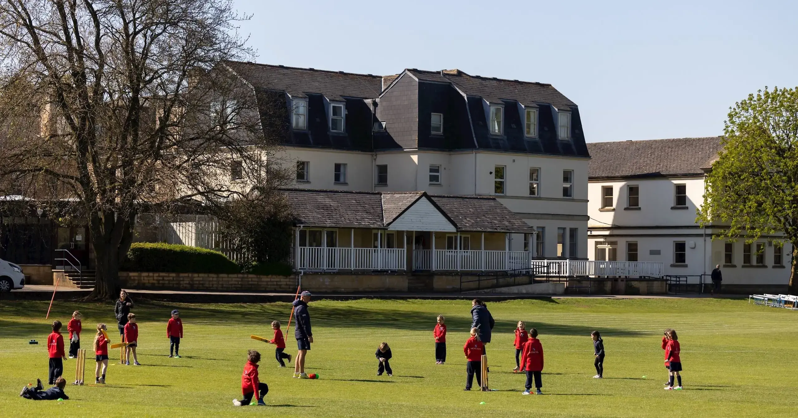 Children on grass outside school