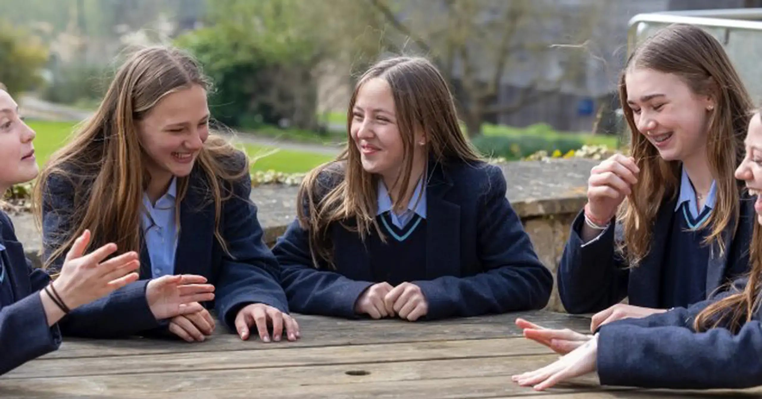 Girls chatting around table