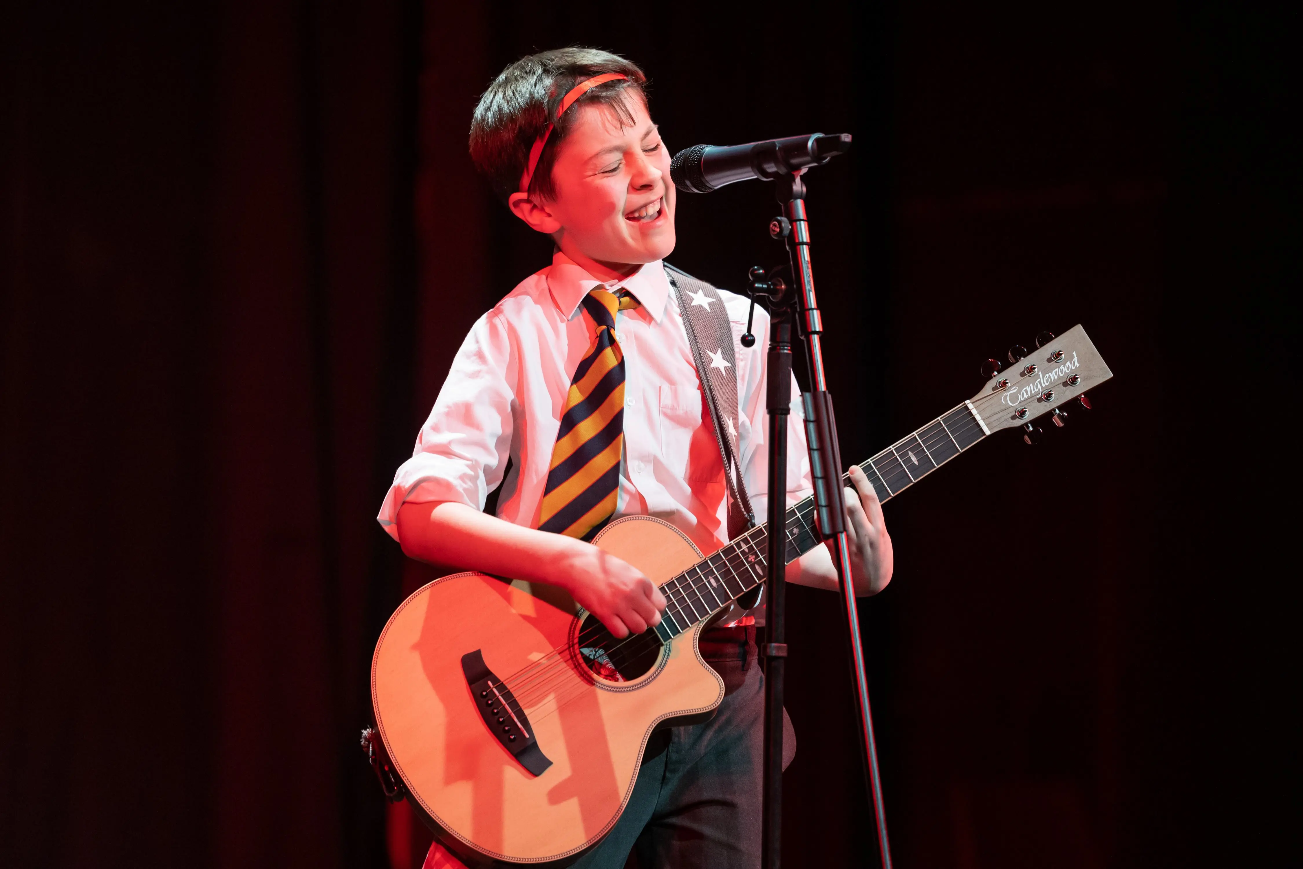 young guitarist performing